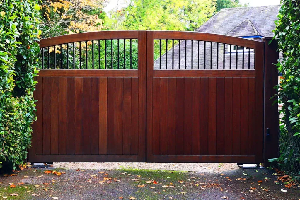 Arch top gates with iron infill bars