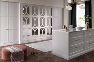 Fitted mirrored wardrobes and island drawers