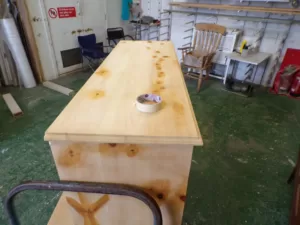 Sideboard knots being prepped before finishing