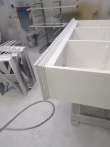 Cupboard being sprayed